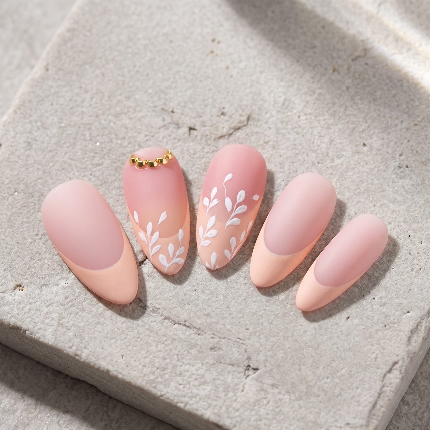 French tip almond nails close up